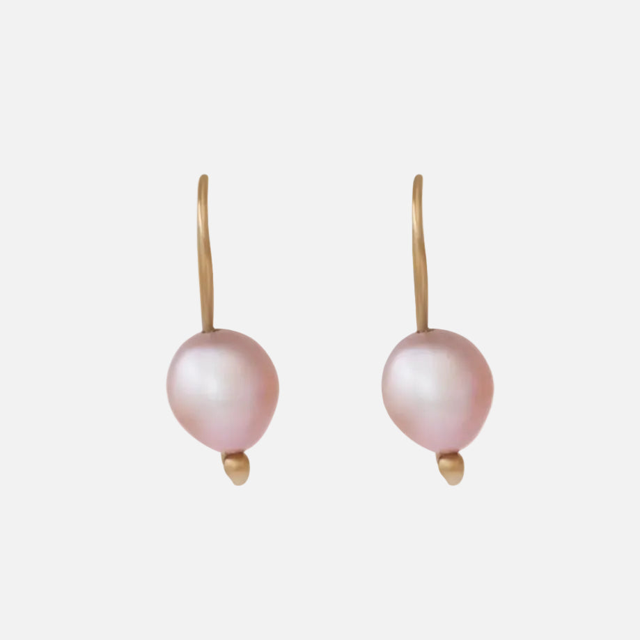 The SWAN PEARL EARRINGS offer an elegant and timeless design crafted with high-quality materials. With their versatile style, these earrings are perfect for both formal occasions and everyday wear. Elevate your look with these stunning and sophisticated accessories. Two 7.7mm pink fresh water pearls 14k yellow gold Satin finish Each earring measures 21.07mm width by 7.88mm length Sold as a pair