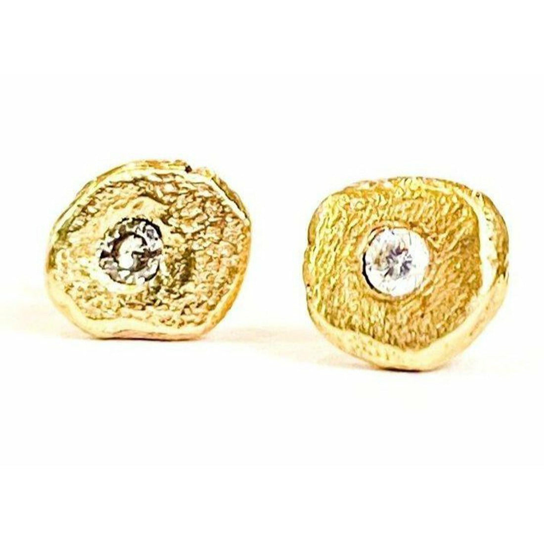 Add a touch of elegance and sophistication to your look with these stunning textured diamond stud earrings. The intricate textured design adds a unique twist to the classic diamond studs, creating a sparkling and glamorous accessory that will elevate any outfit. 1.8 mm pointer diamond flush set. 6mm-6.25 not a regular shape textured. small butterfly back.