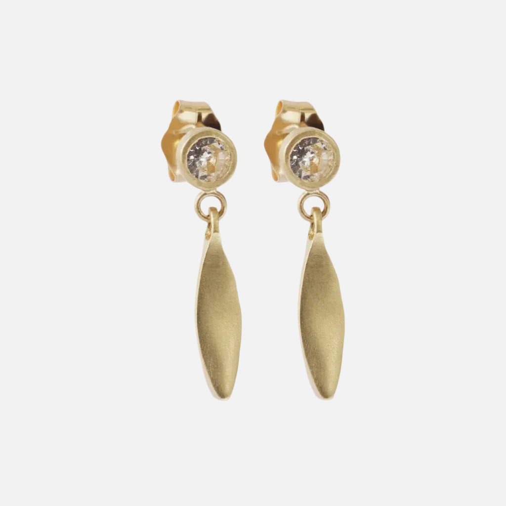 Introducing Diamond Leaf Stud Drops - the epitome of elegance and versatility. With their stunning design and sparkling brilliance, these earrings are the perfect accessory to elevate any outfit. Add a touch of glamour to your look with Diamond Leaf Stud Drops today! Two White Diamonds Diamonds sized at 3mm each 14k Yellow Gold Satin Finish Dimensions (H x W) 17.42mm x 4.0mm Sold as a pair Need different material, stone, finish?