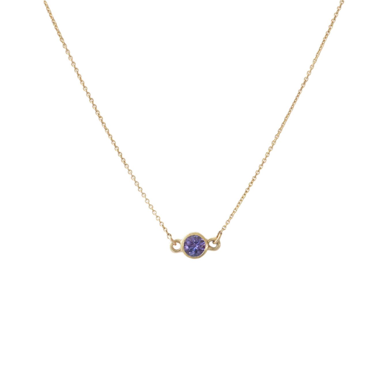 Details The Tanzanite Sparkle Necklace is an exquisite piece of jewelry that exudes elegance and sophistication. With its stunning tanzanite gemstones and sparkling diamonds, this necklace is the perfect accessory for any special occasion. Add a touch of glamour to your ensemble with the Tanzanite Sparkle Necklace. 3.5mm Tanzanite 16" Chain 14k Yellow Gold W x T 8.9mm x 4.8mm