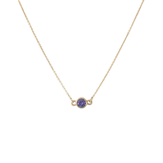 Details  The Tanzanite Sparkle Necklace is an exquisite piece of jewelry that exudes elegance and sophistication. With its stunning tanzanite gemstones and sparkling diamonds, this necklace is the perfect accessory for any special occasion. Add a touch of glamour to your ensemble with the Tanzanite Sparkle Necklace.  3.5mm Tanzanite 16" Chain 14k Yellow Gold W x T 8.9mm x 4.8mm