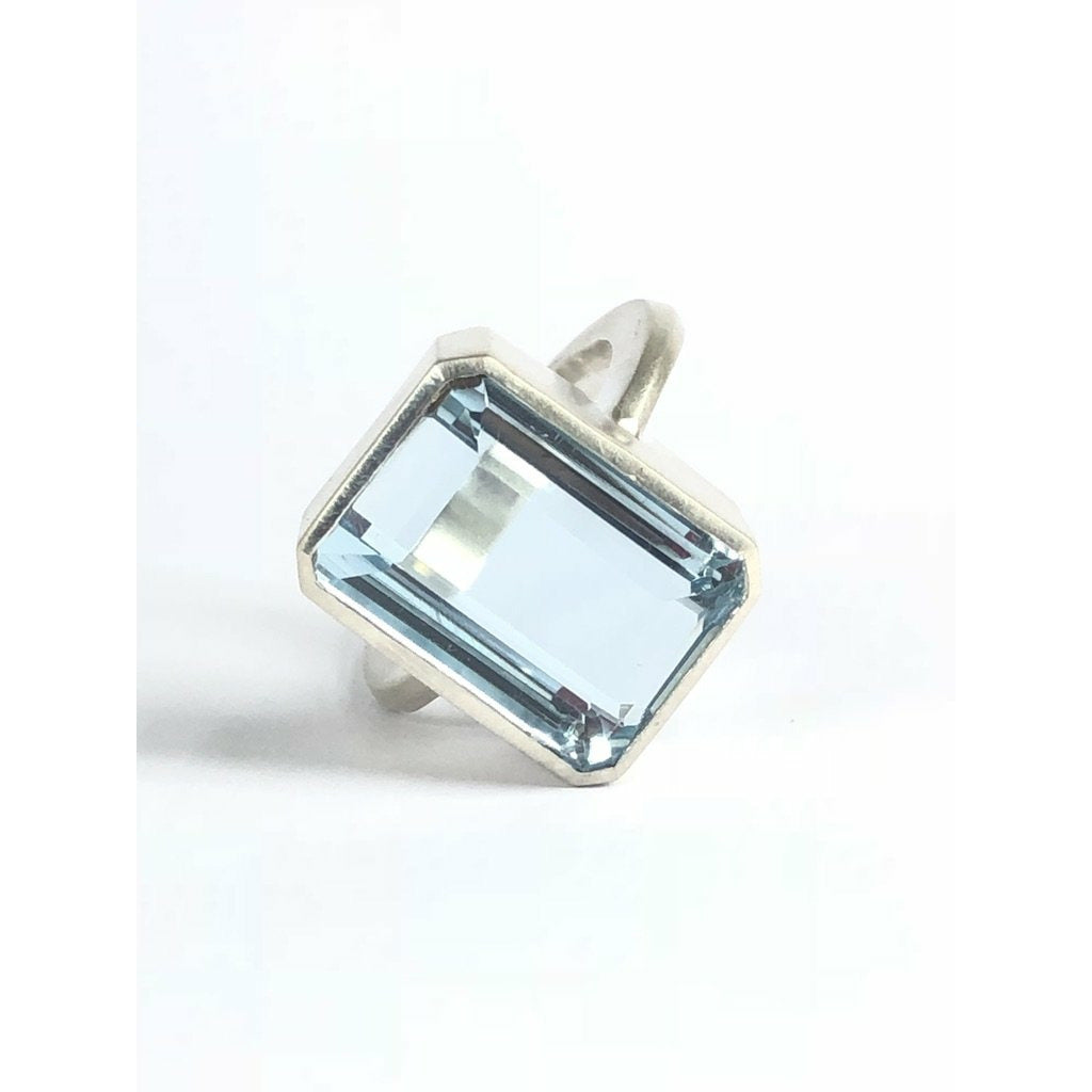 Add a touch of elegance to any outfit with this stunning Bright Blue Topaz Cocktail Ring. The vibrant blue color of the topaz stone is sure to catch everyone's eye, and the elegant cocktail design adds a sophisticated touch. Treat yourself or someone special to this eye-catching ring today! 16mm x 12mm Blue Topaz.