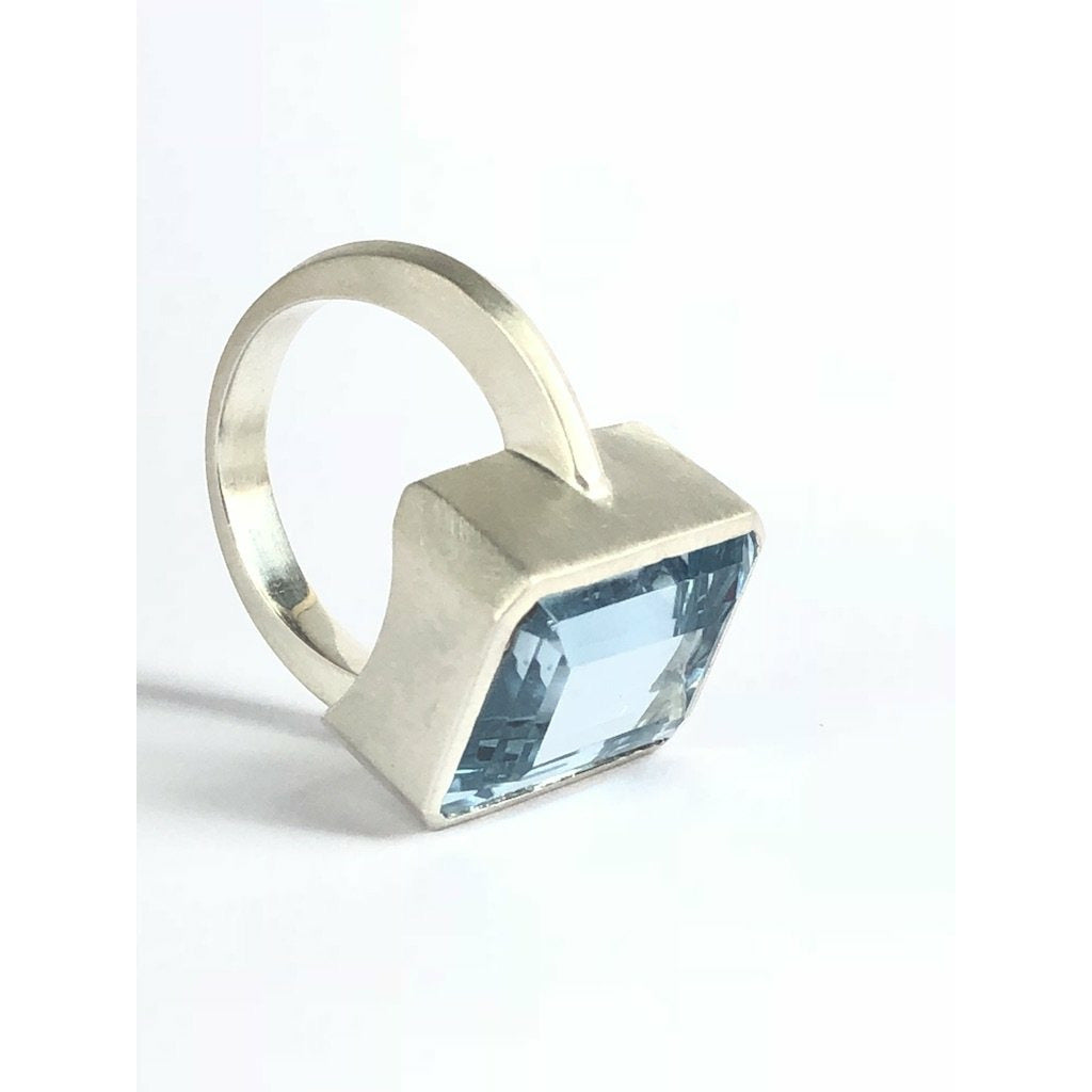Add a touch of elegance to any outfit with this stunning Bright Blue Topaz Cocktail Ring. The vibrant blue color of the topaz stone is sure to catch everyone's eye, and the elegant cocktail design adds a sophisticated touch. Treat yourself or someone special to this eye-catching ring today! 16mm x 12mm Blue Topaz.