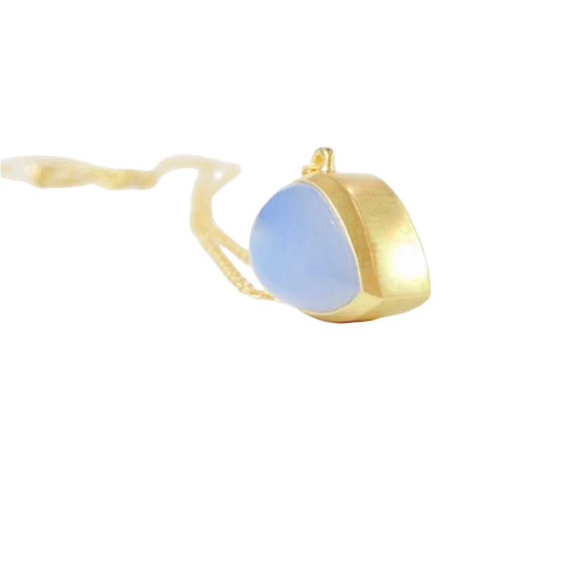 Keep your loved ones close to your heart with our cremation illumination Necklace . Crafted with care, this necklace allows you to carry a small portion of their ashes, providing comfort and a constant reminder of their presence.. Pendant 15mm long x 10 mm wide Handmade clasp Chain with Clasp 16 inch long. 14k Yellow Gold Stone Chalcedony