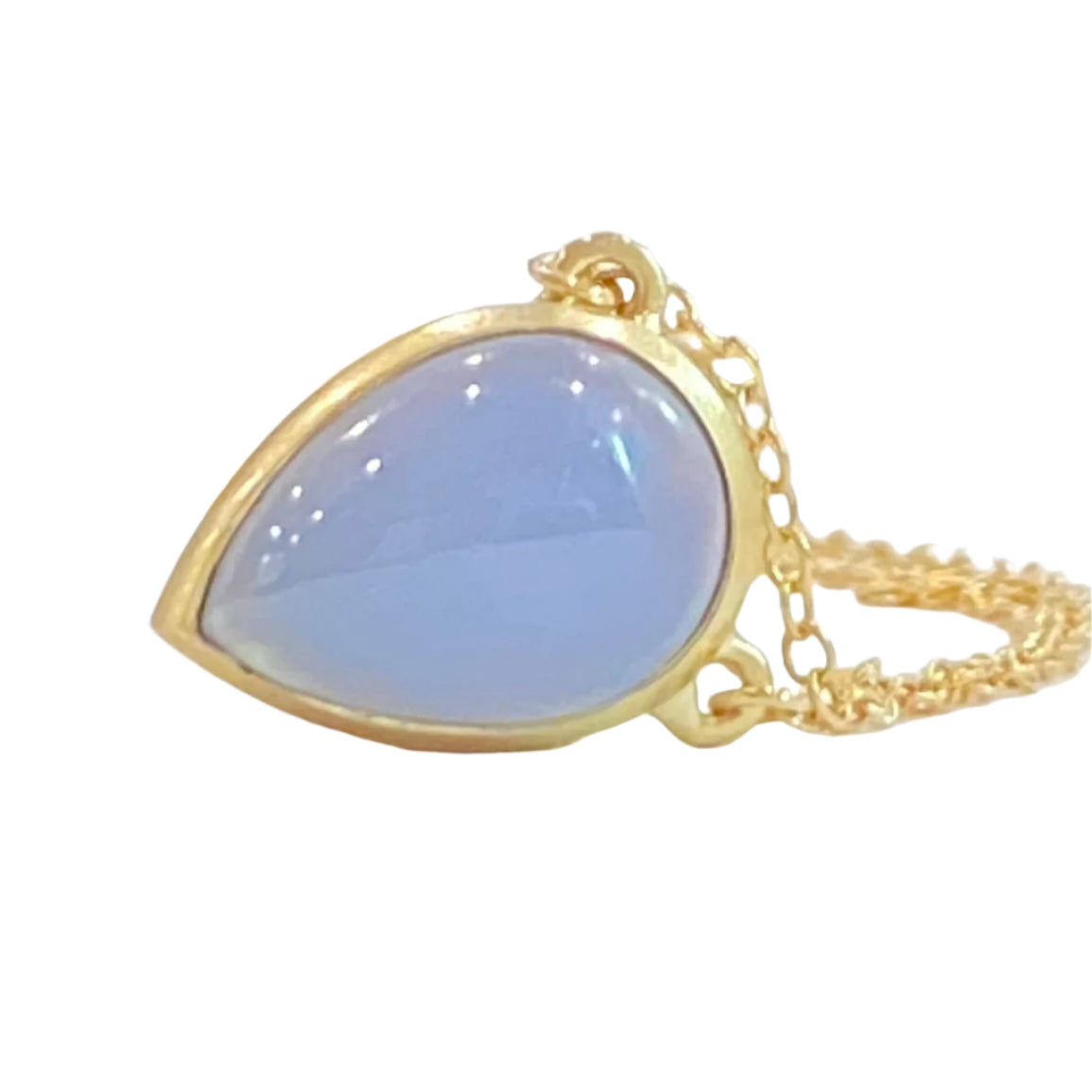 Keep your loved ones close to your heart with our cremation illumination Necklace . Crafted with care, this necklace allows you to carry a small portion of their ashes, providing comfort and a constant reminder of their presence.. Pendant 15mm long x 10 mm wide Handmade clasp Chain with Clasp 16 inch long. 14k Yellow Gold Stone Chalcedony