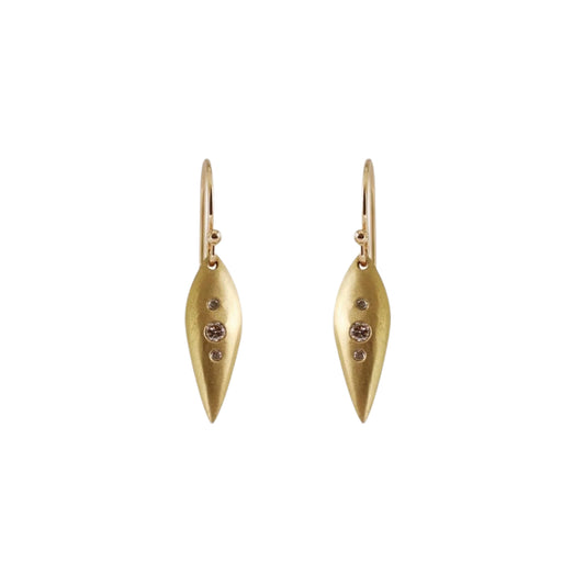 Details  Introducing our exquisite POD EARRINGS, adorned with three dazzling diamonds. These earrings are the perfect accessory to add a touch of sparkle and sophistication to any outfit. Treat yourself or someone special to these stunning earrings today!  4 x 1.5mm Round White Diamonds 2 x 2.25mm Round White Diamonds 14k Yellow Gold Satin Finish HxW: 27.6mm x 6.1mm