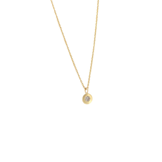 Introducing our exquisite Diamond Dot Necklace, a dazzling piece crafted with sparkling diamonds and a versatile design. This elegant necklace is the perfect accessory to elevate any outfit, adding a touch of sophistication and luxury  1mm round white diamond 16" Chain 14k Yellow Gold Satin Finish HxW: 4mm x 4mm