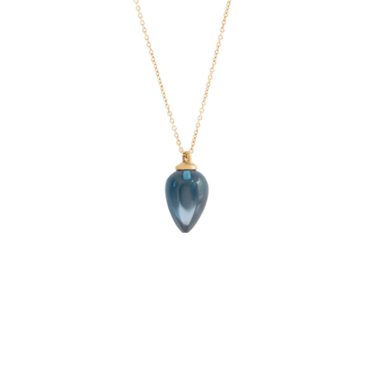 Adorn yourself with the breathtaking beauty of London Blue Topaz. This elegant necklace showcases the stunning blue gemstone w  Pear Shaped Blue Topaz Stone HxW: 13.8mm x 9.05mm 18" Chain 14k Yellow Gold Polished Finish