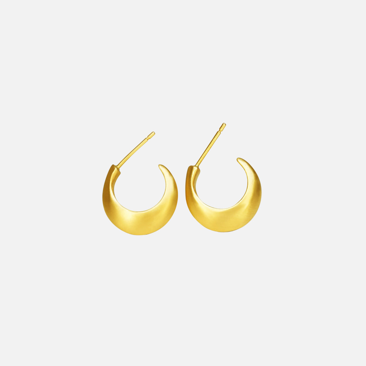 Step up your earring game with our Small Half Moon Hoops. With their versatile design, these hoops are perfect for any occasion. Easy to wear and a classic style. 14k Yellow Gold Satin Finish HxW: 14.04mm x 3.37mm