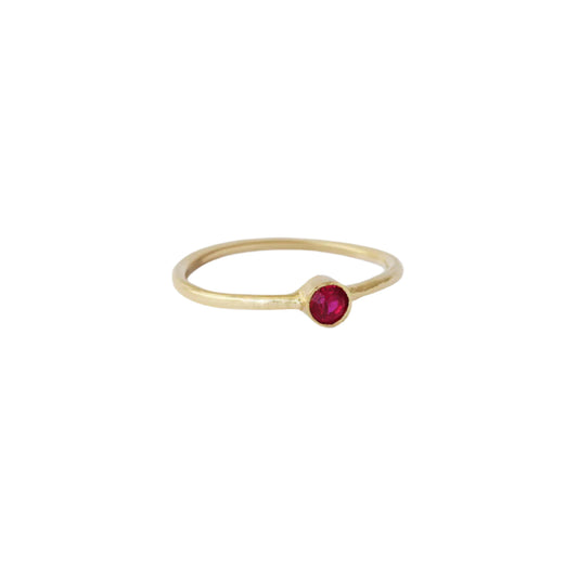 Ruby Dainty Ring, a stunning piece of jewelry with an elegant design that exudes sophistication. The delicate and dainty nature of this ring adds a touch sparkling to any outfit. Featuring a beautiful ruby gemstone, this ring is perfect for those who appreciate timeless beauty.Details  3.05mm Red Ruby 1.4mm Round Band 14k Yellow Gold Hammered texture
