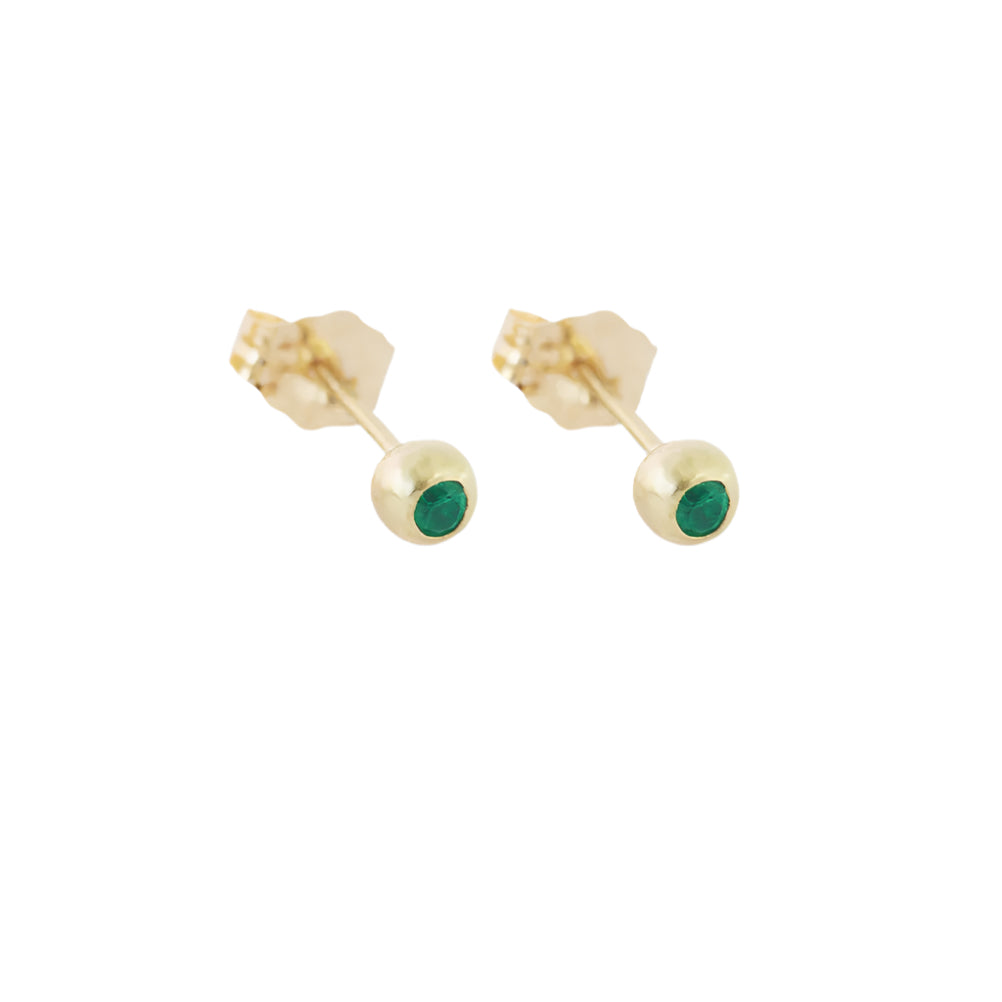 Make a statement with these dainty emerald ball studs. With their timeless elegance and vibrant green hue, they are the perfect accessory to add a touch of sophistication to any outfit Two 1.7mm Emeralds 14k Yellow Gold HxW: 3.48mm x 3.52mm