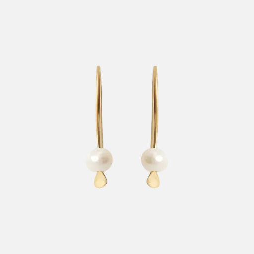 Tiny Pearl Earrings Light as a feather, featuring a delicate and stylish design that adds a touch of sophistication to any outfit. These exquisite earrings are the perfect accessory for those seeking timeless beauty. Details 2 x 3mm Pearl Beads 14k Yellow Gold Each earring measures 4.75mm width by 4.1mm length