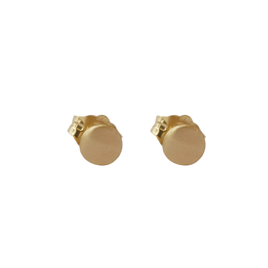 A pair of 14k yellow gold or silver stud earrings with a satin finish. 