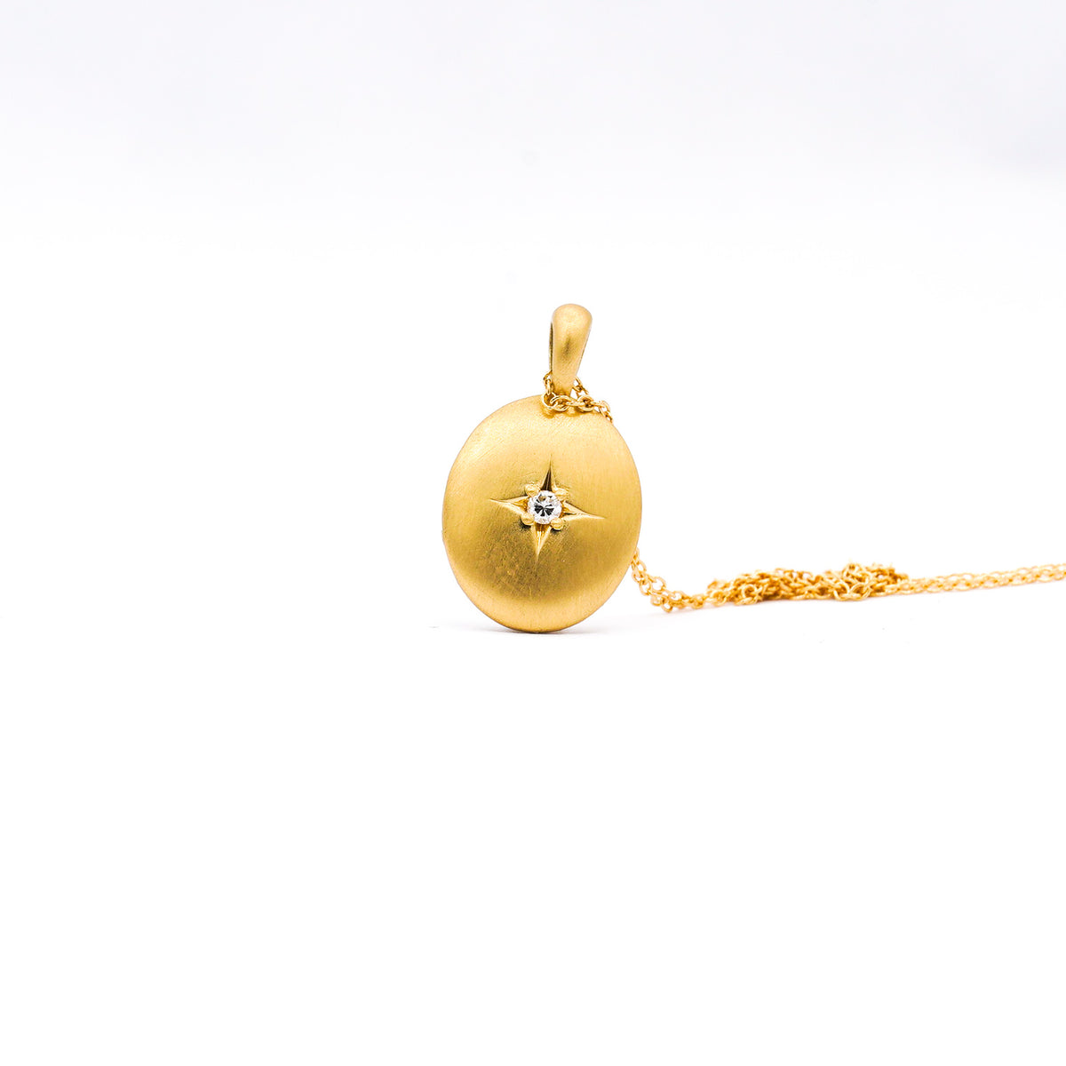 Gold memorial ring with three diamonds and a sealed compartment for ashes