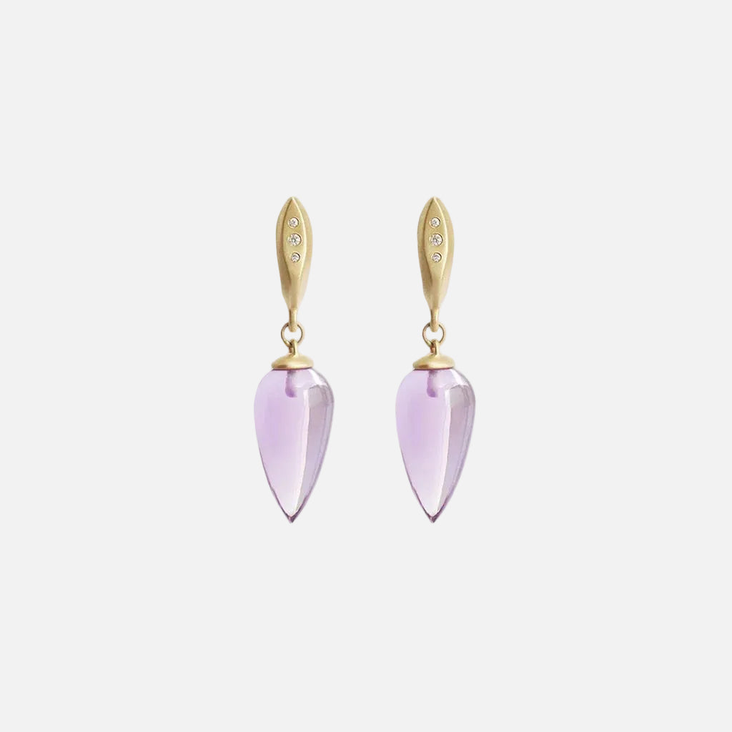 The Amethyst Drops with Diamonds are a Classic earring with a modern touch.  A single polished Amethyst teardrop hangs from a hand formed earring with 3 gorgeous Ethically sourced Diamonds.  Details  19mm Tear shaped Amethysts 6 White Diamonds 0.03ct 14k Yellow Gold Each earring measures 9.3mm width by 37mm length butterfly back