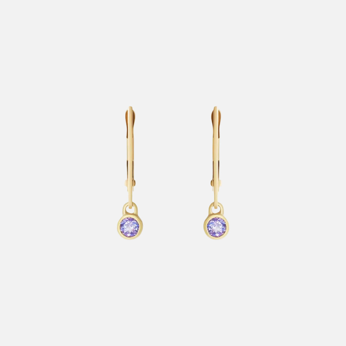Indulge in the exquisite beauty of tanzanite with these stunning earrings. Crafted with elegance and sophistication, these earrings showcase the mesmerizing allure of tanzanite gemstones, making them the perfect accessory for any special occasion.  3mm Tanzanite 14k Yellow Gold Each earring measures 4mm width by 4.2mm length French Backs
