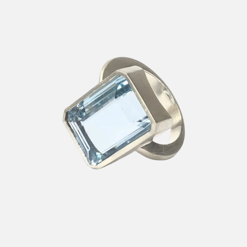 Add a touch of elegance to any outfit with this stunning Bright Blue Topaz Cocktail Ring. The vibrant blue color of the topaz stone is sure to catch everyone's eye, and the elegant cocktail design adds a sophisticated touch. Treat yourself or someone special to this eye-catching ring today!  16mm x 12mm Blue Topaz.
