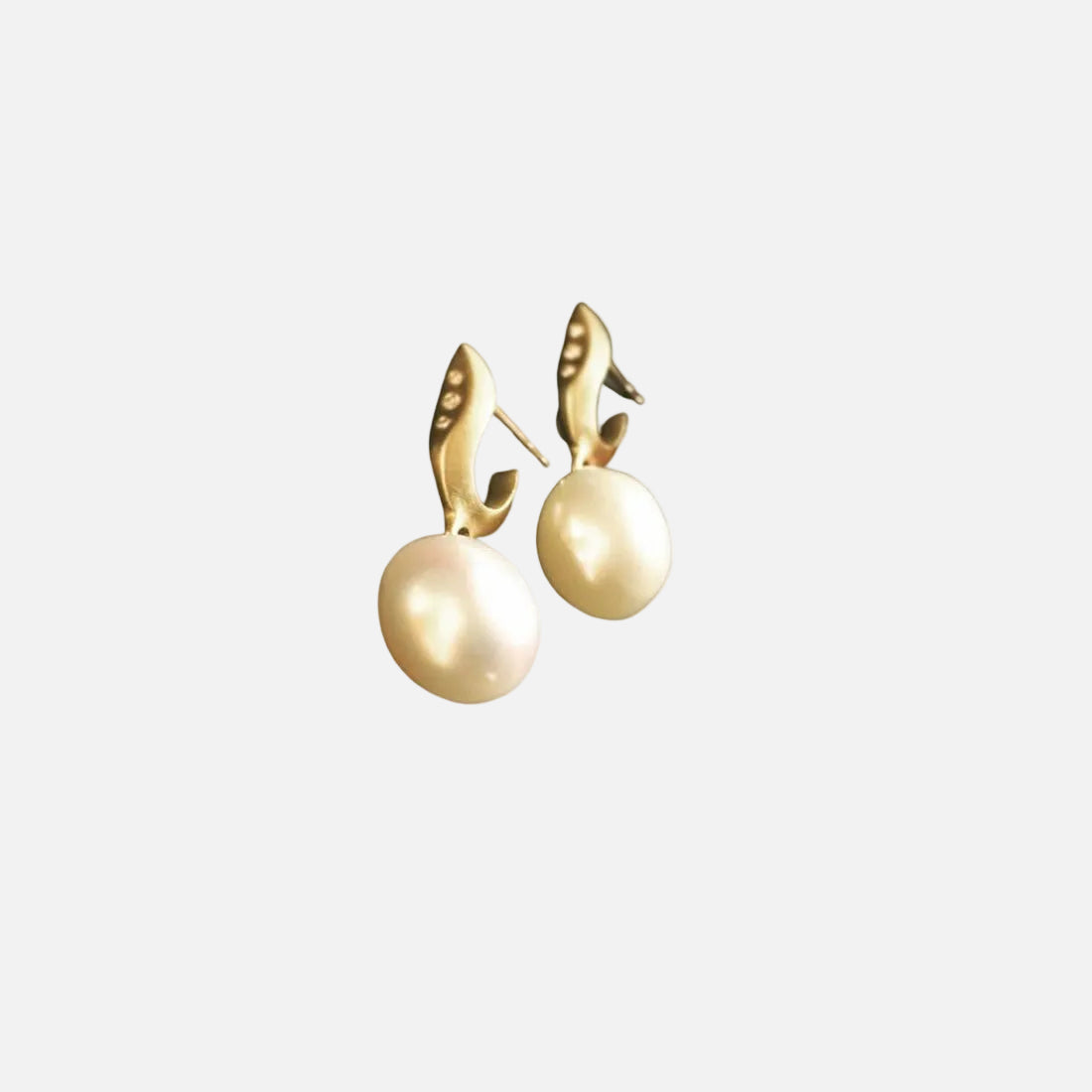 Add a touch of elegance to your ensemble with these stunning Button Pearl Earrings. Crafted with high-quality Japanese pearls, these earrings exude sophistication and timeless beauty. Elevate your style and make a statement with these exquisite earrings.   Ear piece 10mm  3 x 1 pointer diamonds  8mm -10mm Japanese pearls