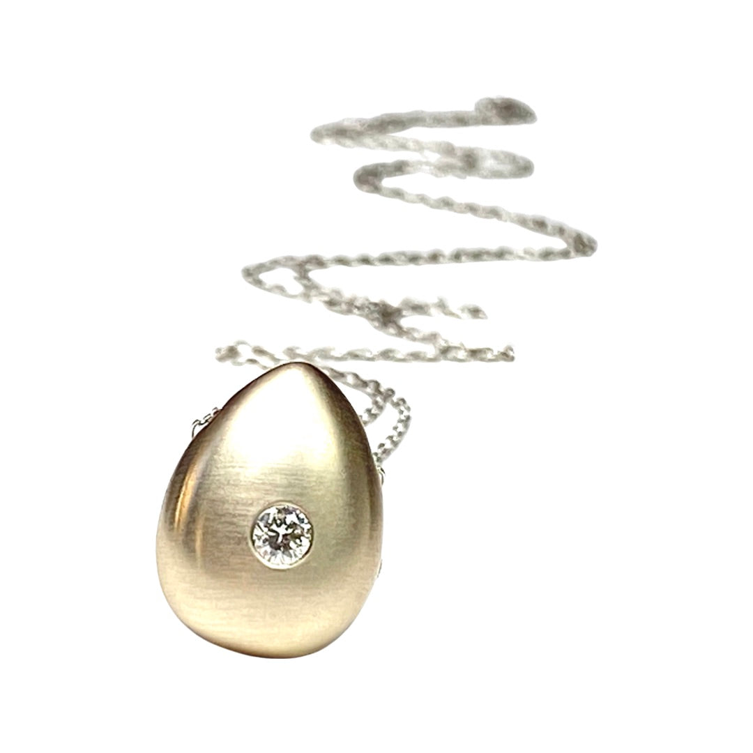 Keep your loved ones close to your heart with our cremation Diamond necklace. Crafted with care, this necklace allows you to carry a small portion of their ashes, providing comfort and a constant reminder of their presence.Holding Diamond Cremation ashes memorial Urn Pendant     Details  -3mm 10 pointer Diamond  -1.5 mm 24 inch cable chain is endless with no catch, you can also specify the length there may be a extra charge.