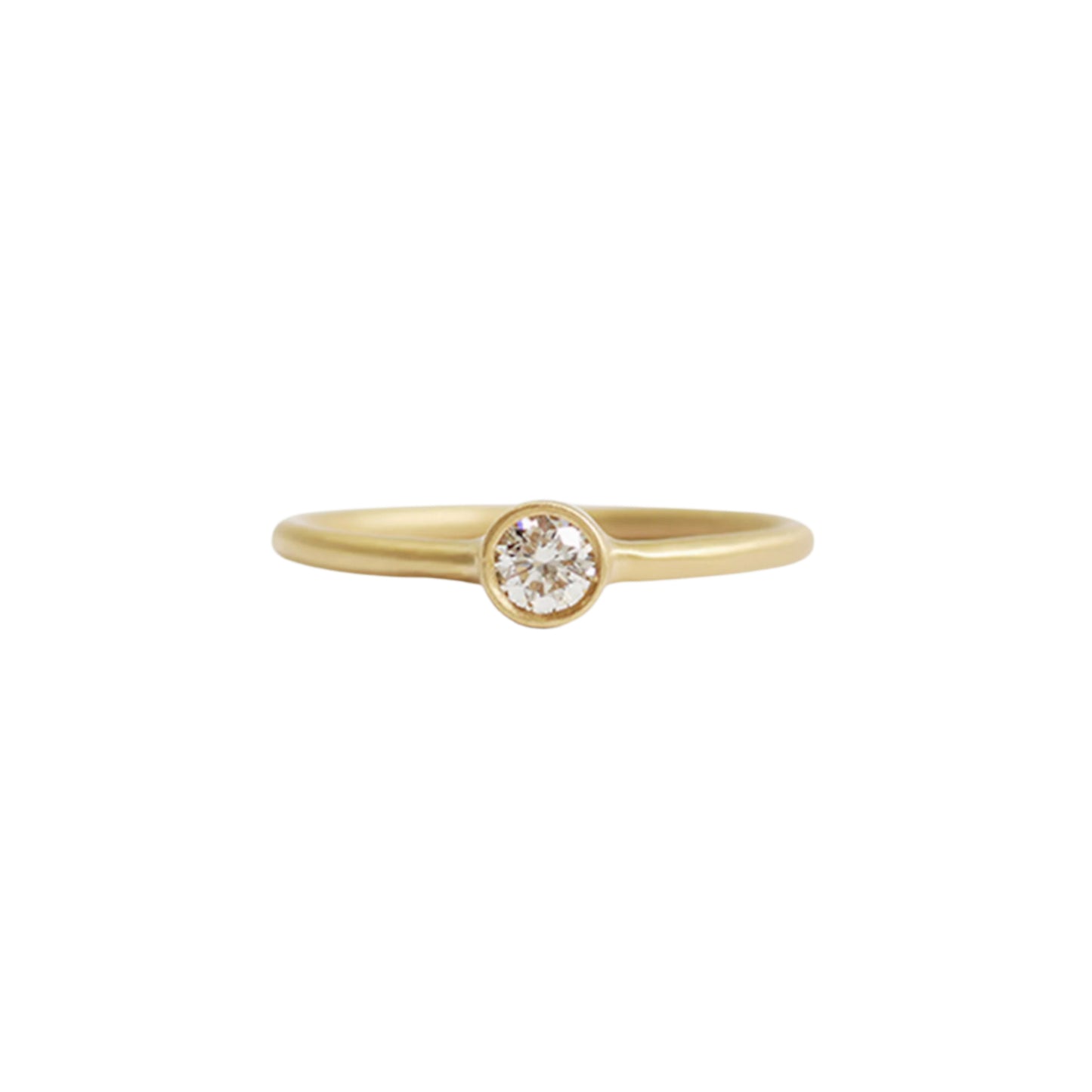 Details  Indulge in the timeless elegance of our Single Diamond Ring. This sparkling centerpiece features exquisite craftsmanship that will captivate your heart and dazzle on your finger. Elevate your style and make a statement with this stunning piece of jewelry.  3mm Round White Diamond Round Band 14k Yellow Gold Satin Finish WxT: 1.45mm