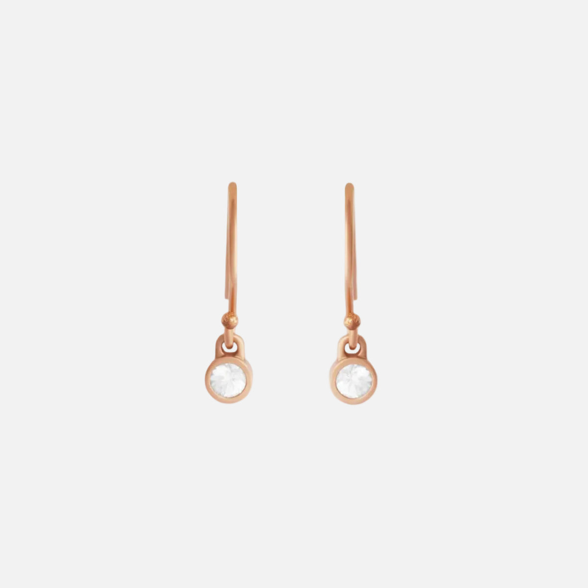 our exquisite Pink Gold & Sapphire Earrings. Crafted with precision and attention to detail, these earrings are the perfect combination of elegance and luxury. The stunning pink gold setting showcases the brilliance of the sapphire gemstones, creating a timeless and sophisticated piece of jewelry. 2 x 2.5mm Sapphires 0.75mm Wire 14k Rose Gold Satin Finish Each earring measures 16.6mm width by 4mm length