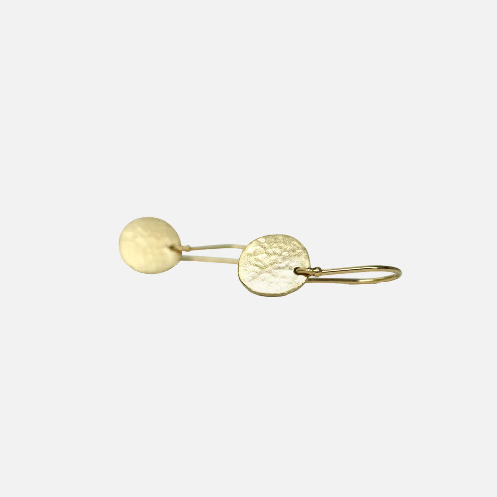 Complete your trendy and chic look with these stylish Small Sidewalk Disk Earrings. Made with high-quality materials, these earrings are the perfect accessory to elevate any outfit. Light and easy everyday charmers.  Handmade ear wires adorning a simple disk.  10mm disk.