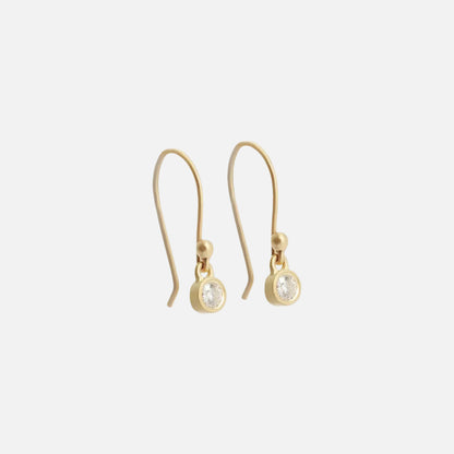 Dainty delicate Diamond drops.  Crafted with sparkling diamonds and featuring a dainty drop design, these earrings are the perfect accessory to add a touch of sophistication to any outfit. Elevate your style and make a statement with our exquisite Diamond Drop Earrings.  Details  2 x 3mm White Diamonds 14k Yellow Gold Satin Finish HxW: 20.05mm x 4.1mm