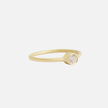 Indulge in the timeless elegance of our Single Diamond Ring. This sparkling centerpiece features exquisite craftsmanship that will captivate your heart and dazzle on your finger. Elevate your style and make a statement with this stunning piece of jewelry.  3mm Round White Diamond Round Band 14k Yellow Gold Satin Finish WxT: 1.45mm