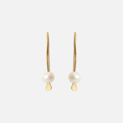 Tiny Pearl Earrings Light as a feather,  featuring a delicate and stylish design that adds a touch of sophistication to any outfit. These exquisite earrings are the perfect accessory for those seeking timeless beauty.  Details  2 x 3mm Pearl Beads 14k Yellow Gold Each earring measures 4.75mm width by 4.1mm length