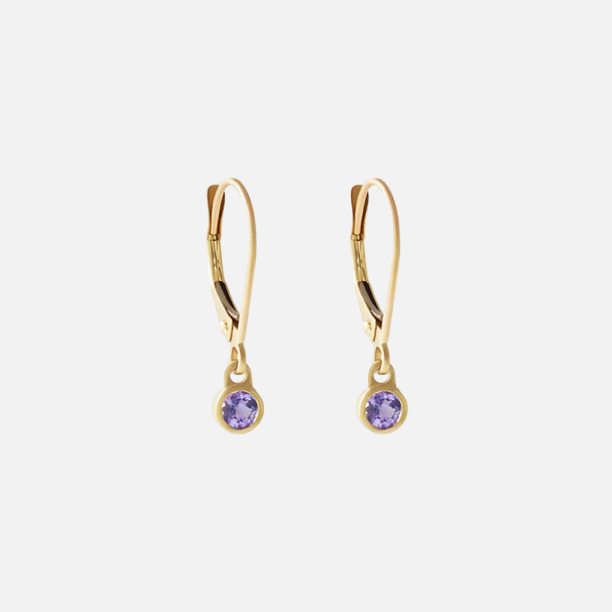 Details Indulge in the exquisite beauty of tanzanite with these stunning earrings. Crafted with elegance and sophistication, these earrings showcase the mesmerizing allure of tanzanite gemstones, making them the perfect accessory for any special occasion.  3mm Tanzanite 14k Yellow Gold Each earring measures 4mm width by 4.2mm length French Backs