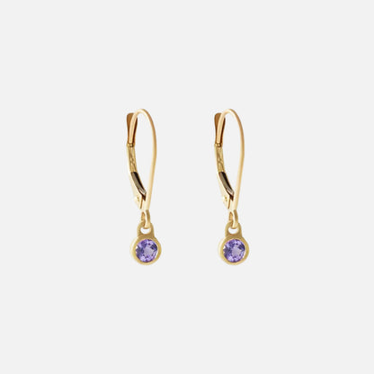 Details Indulge in the exquisite beauty of tanzanite with these stunning earrings. Crafted with elegance and sophistication, these earrings showcase the mesmerizing allure of tanzanite gemstones, making them the perfect accessory for any special occasion.  3mm Tanzanite 14k Yellow Gold Each earring measures 4mm width by 4.2mm length French Backs