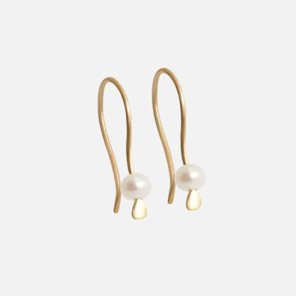 Tiny Pearl Earrings Light as a feather,  featuring a delicate and stylish design that adds a touch of sophistication to any outfit. These exquisite earrings are the perfect accessory for those seeking timeless beauty. Details  2 x 3mm Pearl Beads 14k Yellow Gold Each earring measures 4.75mm width by 4.1mm length